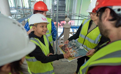 Young V&A Youth Collective members touring the construction site before opening.